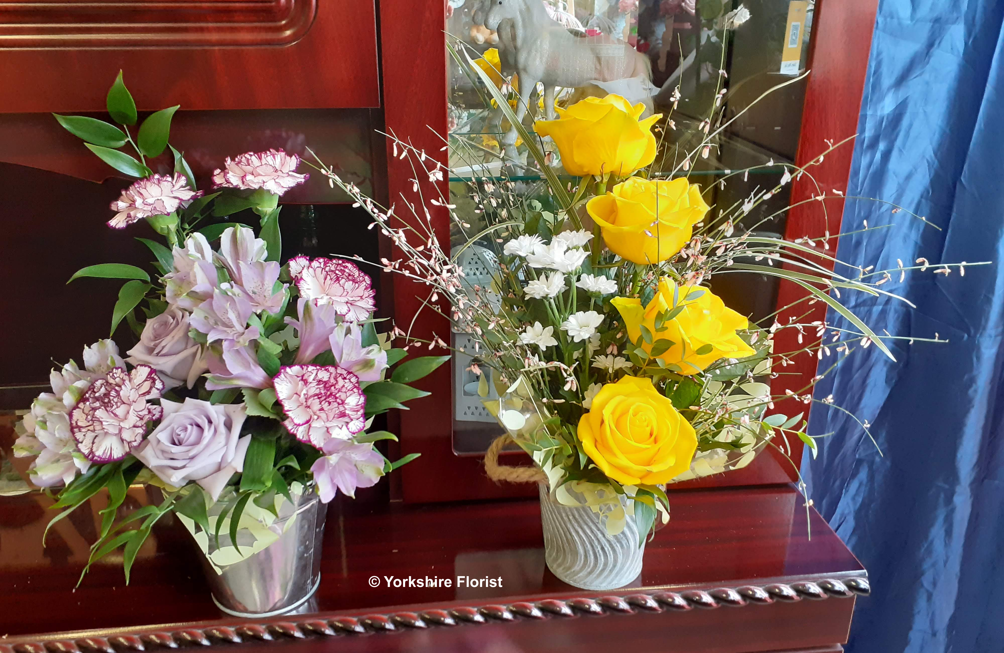 fresh flowers in tin bucket arrangements